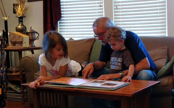 Phil Kniss spends time with two of his grandchildren during his sabbatical. Photo courtesy of Phil Kniss