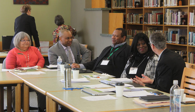  Iris de León-Hartshorn, Associate Executive Director for Operations; Glen Guyton, Executive Director; Leslie Francisco III, Executive Board, Zenobia Sowell-Bianchi, Executive Board; and Ervin Stutzman, former Executive Director, converse in between sessions at the Constituency Leadership Council Photo: MC USA staff