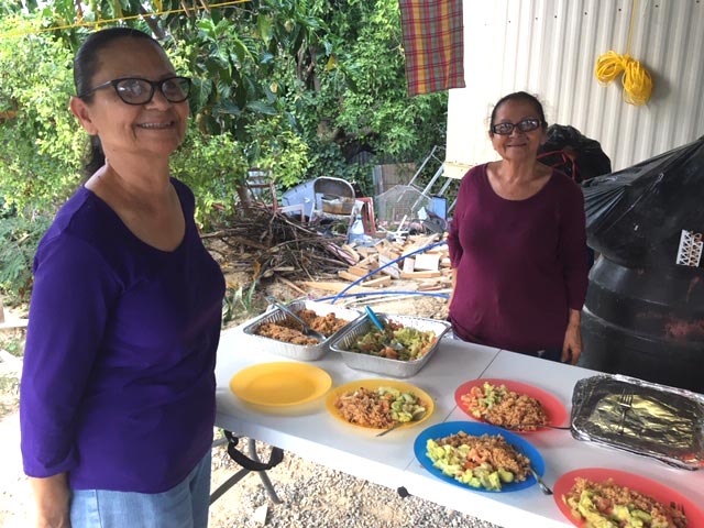 Women in Puerto Rico serve food to the Community Mennonite Church MDS volunteers rebuilding after Hurricane Maria in 2018. Courtesy of Sam Miller