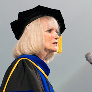 Retiring psychology professor Judy Mullet speaks to graduates at the 2019 commencement ceremony. EMU photo