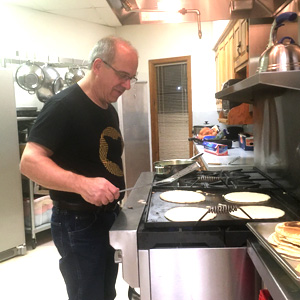 Pastor Clair Good cooks pancakes for WARM. Waynesboro Mennonite Church hosts the shelter one week a year.
Photo courtesy of Clair Good