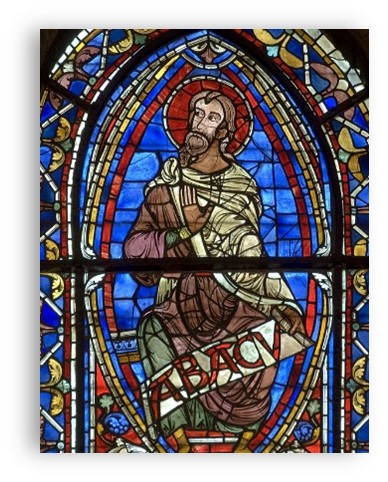 stainglass window of Jesus in side of an oval, eye shapd